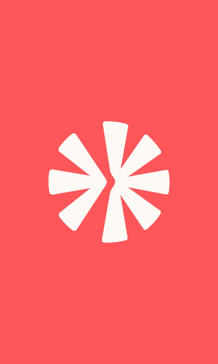Symbole Régis crème sur fond corail.